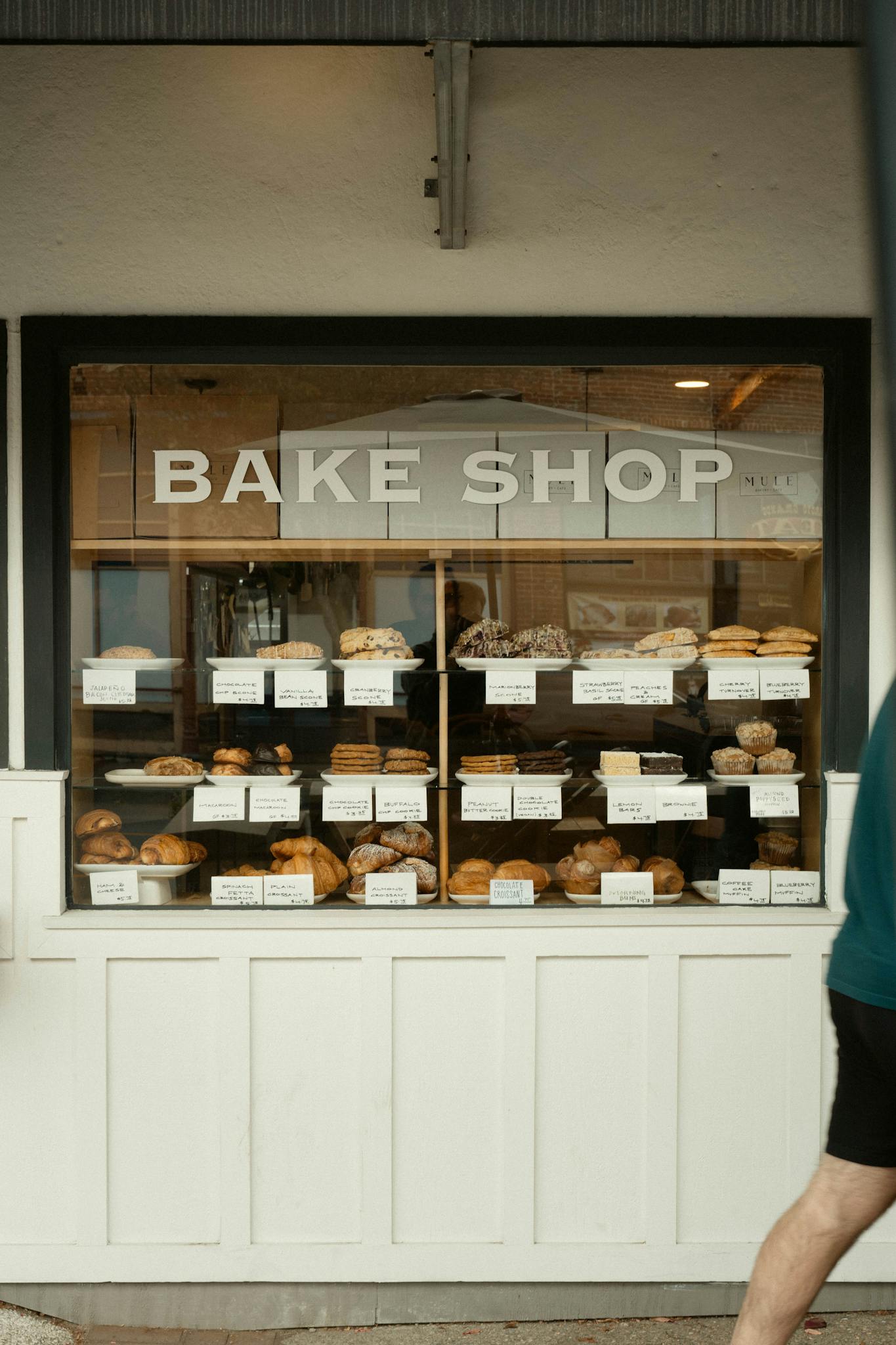 A variety of fresh pastries and breads in a quaint bake shop in Arroyo Grande, California.
