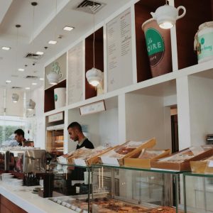A well-lit bakery with a modern design featuring a variety of pastries on display. Perfect for food lovers.